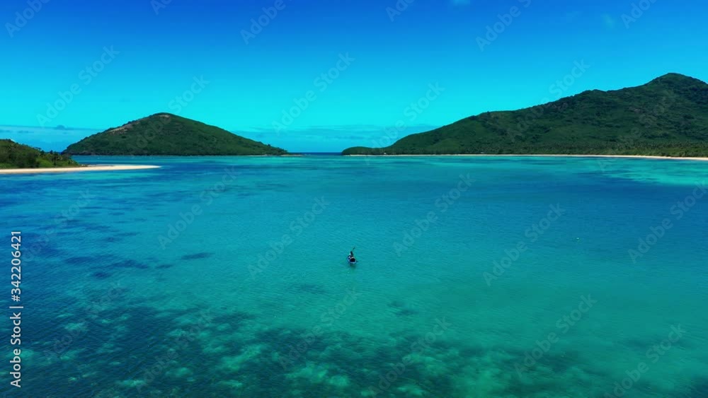 Adventure couple enjoying the gorgeous scene of tropical Fiji islands, drone 4K Adventure couple enjoying the gorgeous scene of tropical Fiji islands, drone 4K