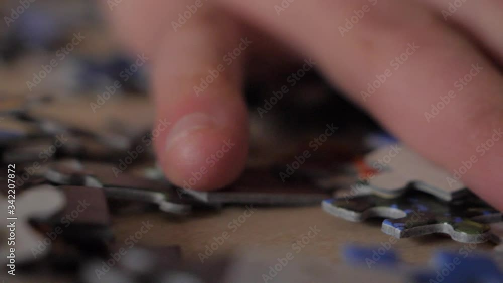 Slowmotion of hand splitting puzzle pieces. Slowmotion of hand splitting puzzle pieces.