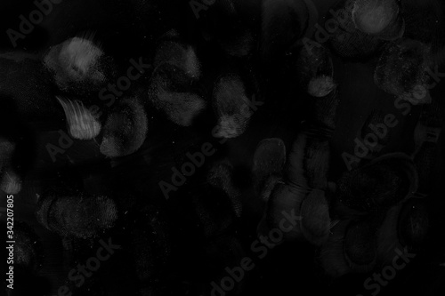 Finger Prints on solid black surface, macro shot