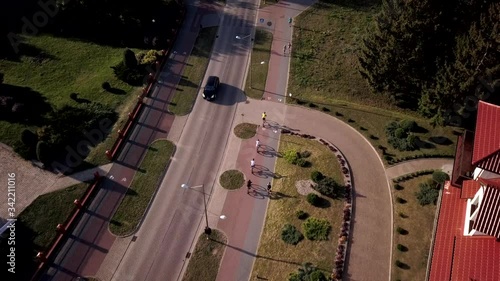 Aerial shot of a group of tourists exploring Goldap town by bike in Poland photo