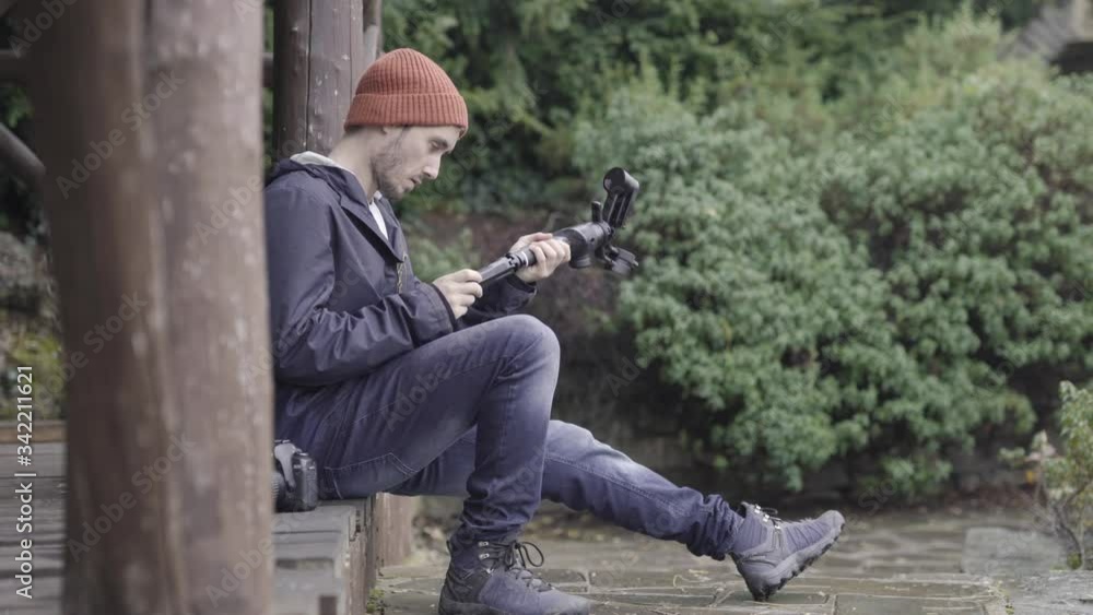 Camera stabilizing gimbal, nature background Camera stabilizing gimbal, nature background