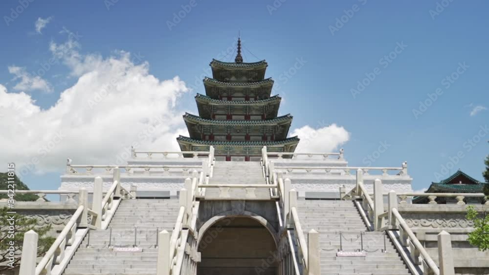 Low angle front view of a Gyeongbokgung Palace structure in Seoul Korea on a clear day, wide shot in slow motion. Low angle front view of a Gyeongbokgung Palace structure in Seoul Korea on a clear day, wide shot in slow motion.