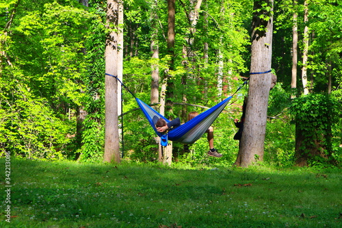 Father and kids relaxing on the hammock