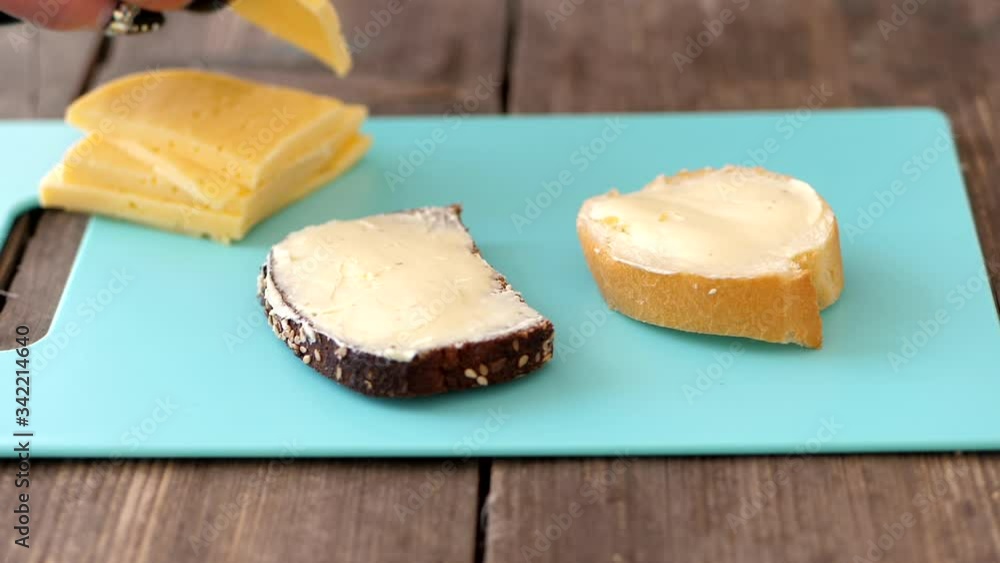 Adding Cheese Toppings On Slices Of Bread - Closeup Shot Adding Cheese Toppings On Slices Of Bread - Closeup Shot