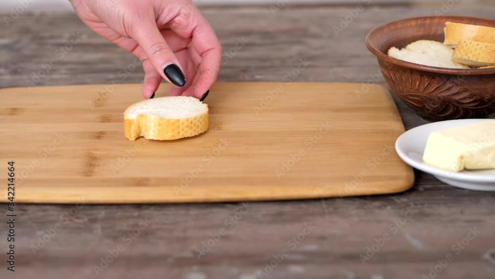Preparing An Easy Homemade Sandwich Recipe With A Sliced Of White Bread And Butter - Closeup Shot Preparing An Easy Homemade Sandwich Recipe With A Sliced Of White Bread And Butter - Closeup Shot