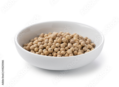 White pepper in a plate placed on a white background