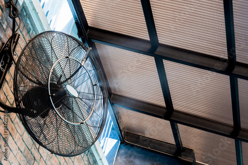 water mister fan, spray misting fan Keep cool and reduce dust in the air. It was installed at the wall in a high place under the roof so that the temperature dropped.