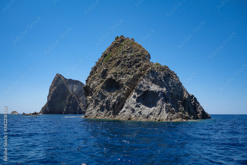View of a big cliff along the seacoast in Ponza island (Latina, Italy).