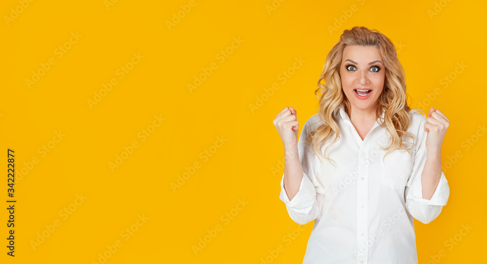 The concept of tension, games and emotions. An encouraged, excited pretty woman in a white shirt, rooting for the team, The concept of tension, games and emotions. An encouraged, excited pretty woman in a white shirt, rooting for the team,