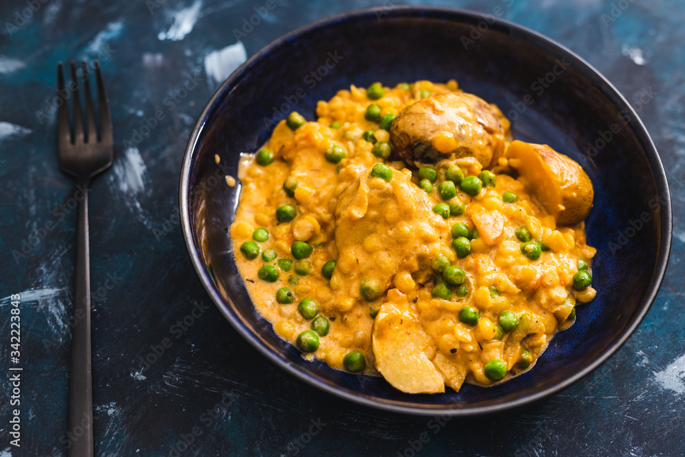 plant-based food, baked potaotes with yellow peas and peas in creamy vegan sauce plant-based food, baked potaotes with yellow peas and peas in creamy vegan sauce
