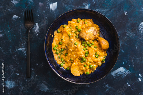 plant-based food, baked potaotes with yellow peas and peas in creamy vegan sauce