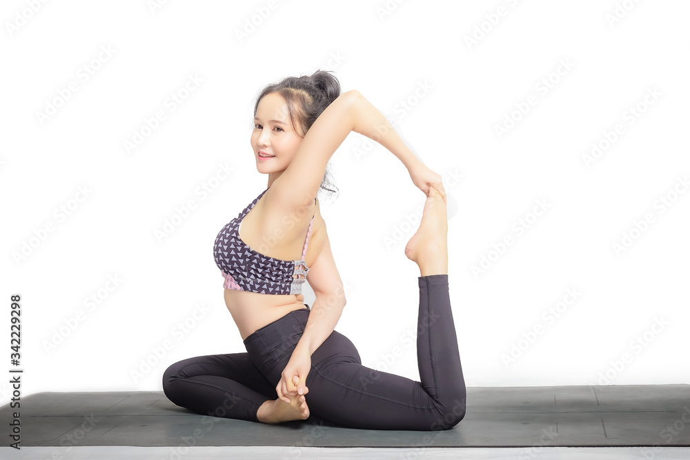 Young Asian woman practicing yoga in the park Young Asian woman practicing yoga in the park