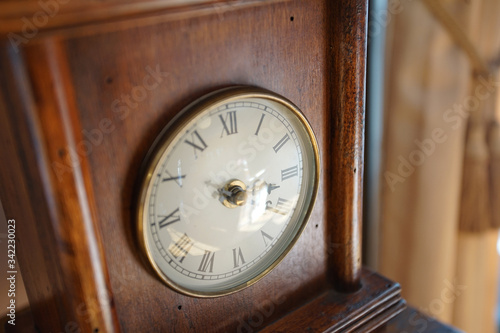 antique clock on wooden background