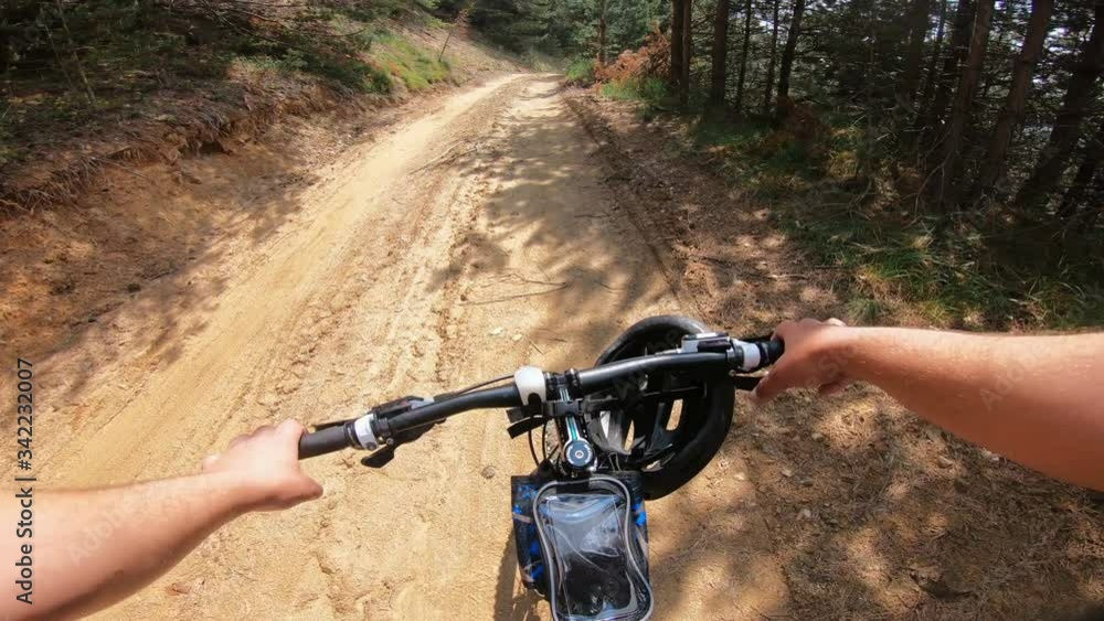 Cross country mountain biking friends in tropical forest. POV point of view Cross country mountain biking friends in tropical forest. POV point of view