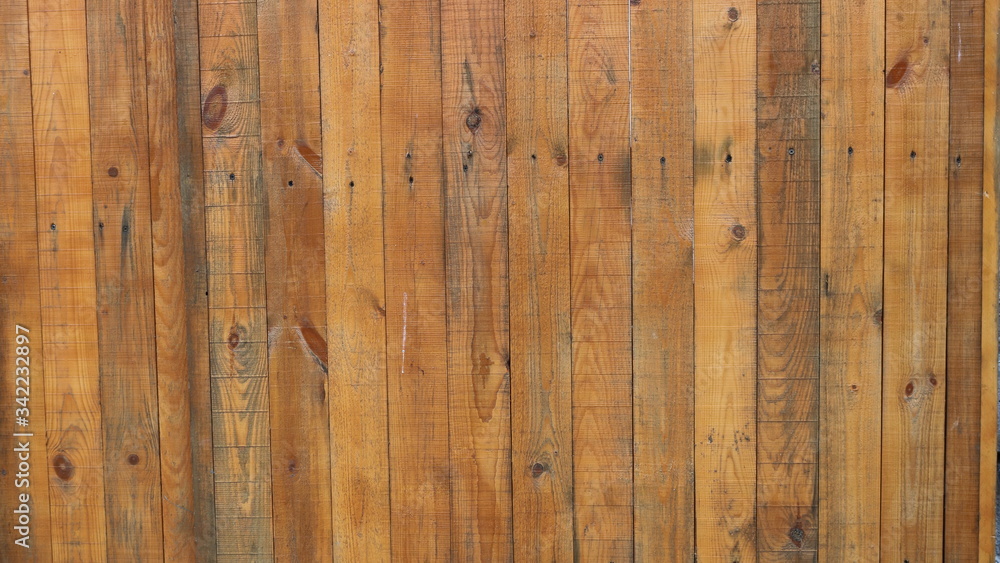 bright saturated wooden planks of solid wood fence planks