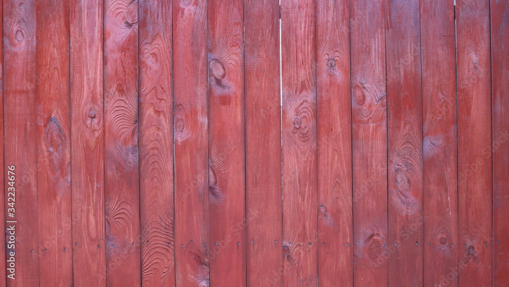 surface of mahogany wooden planks coated with stain and varnish surface of mahogany wooden planks coated with stain and varnish