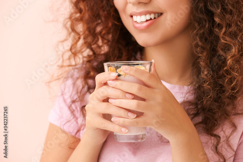 Young woman with tasty yogu...