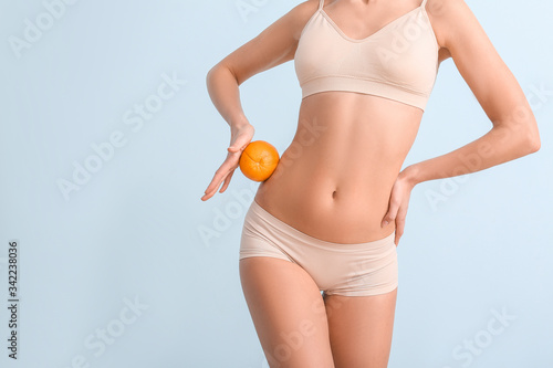 Young woman with orange fru...