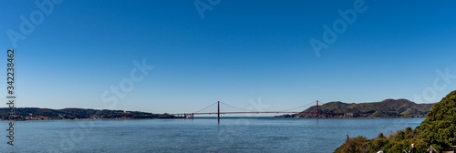 Panorama shot of the San Francisco California Downtown Skyline and Golden Gate Bridge from Alcatraz viewing deck