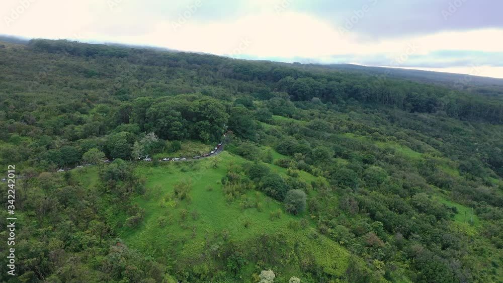 High aerial panoramic flight toward cars backed up on Hana Highway, Maui High aerial panoramic flight toward cars backed up on Hana Highway, Maui