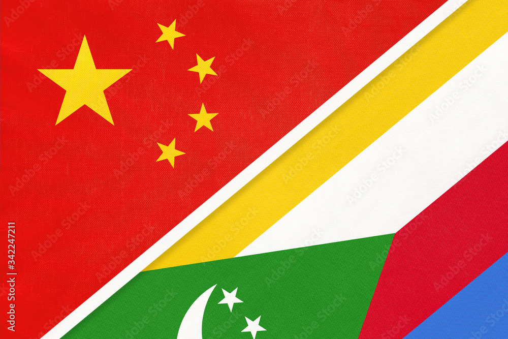 China or PRC vs Union of the Comoros national flag from textile. Relationship between Asian and African countries. China or PRC vs Union of the Comoros national flag from textile. Relationship between Asian and African countries.