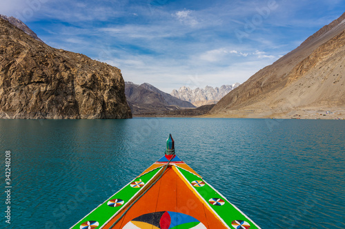 Colorfull boat in Attabad lake in Hunza valley, Karakoram montains range in Pakistan © skazzjy