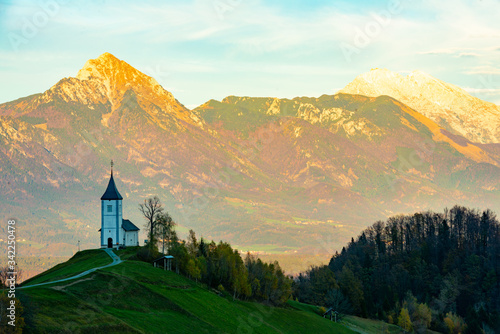 mountain church in slovenia before sunset