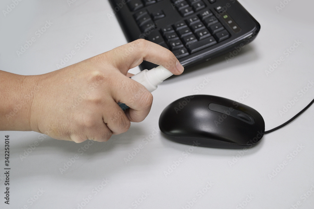 Clean before touching the mouse or office equipment with alcohol spray to prevent Covid-19 (Coronavirus). Clean before touching the mouse or office equipment with alcohol spray to prevent Covid-19 (Coronavirus).