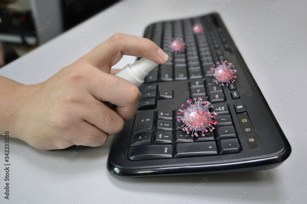 Clean before touching the keyboard or office equipment with alcohol spray to prevent Covid-19 (Coronavirus). 3d illustration Clean before touching the keyboard or office equipment with alcohol spray to prevent Covid-19 (Coronavirus). 3d illustration