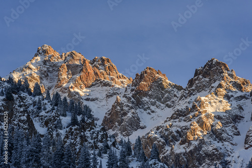 Peak of Abay at winter in the rays of the setting sun..Kazakhstan, the vicinity of Almaty