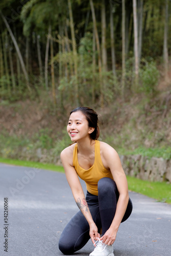A young Asian female motion in the outdoor