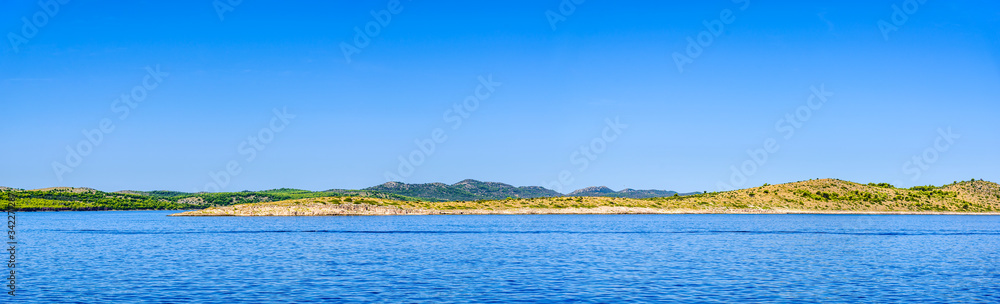 Panorama of Sea and Croatian coast, scenic view during the cruise in the Adriatic Sea with rocky beach in Croatia. Vacation and travel concept