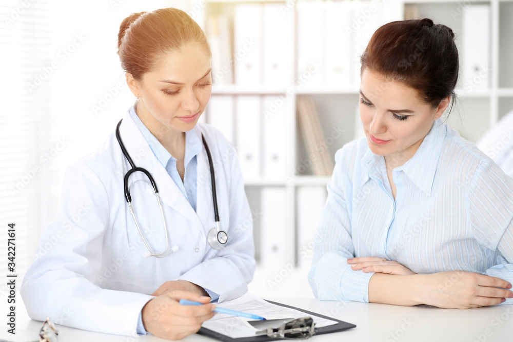 Doctor and patient sitting at the table. Very bad news concept. Doctor and patient sitting at the table. Very bad news concept.
