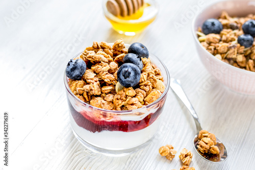 Healthy morning with granola breakfast on white kitchen table