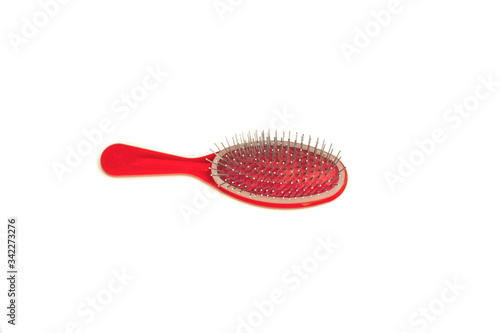 red hairbrush isolated on a white background