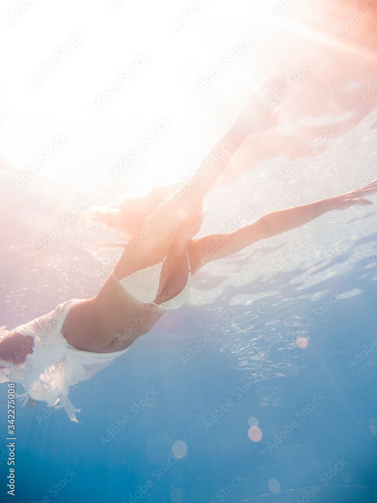Fototapeta premium Woman underwater at the pool