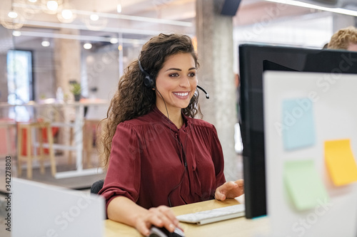 Happy smiling woman working in call center photo