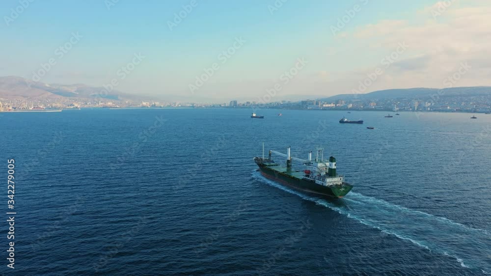 Aerial view of tanker sailing at calm blue sea on sunny day Aerial view of tanker sailing at calm blue sea on sunny day