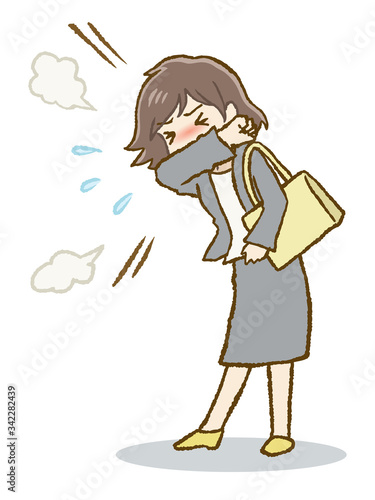 咳マナーを守って咳をするスーツ女性