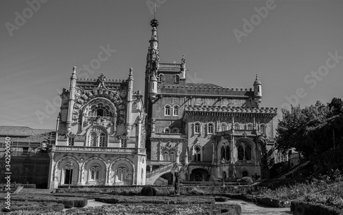 old building with arch and windows in ancient palace photo