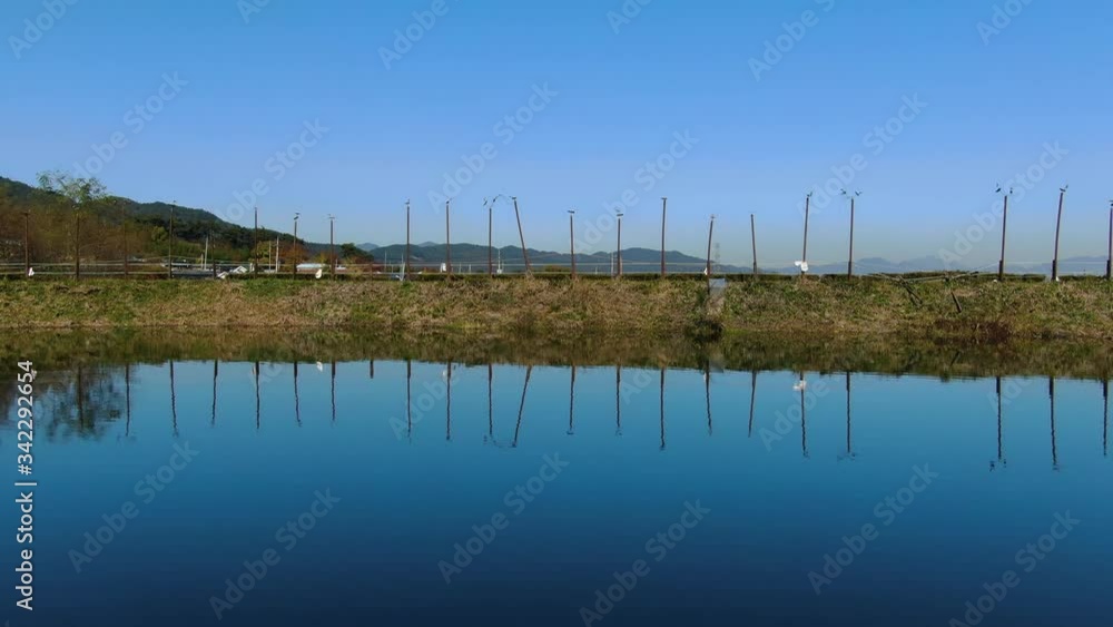 the blue sky reflected in the tranquil reservoir. the blue sky reflected in the tranquil reservoir.