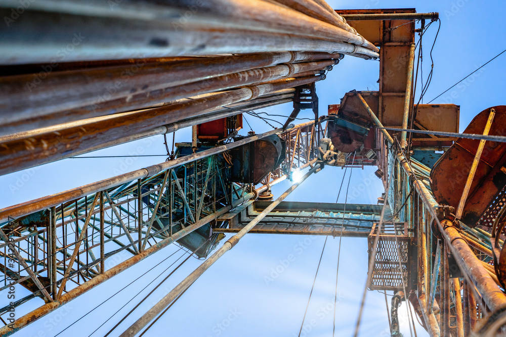 Drilling rig in oil field for drilled into subsurface in order to produced crude, inside view. Petroleum Industry. Onshore drilling rig. Drilling rig in oil field for drilled into subsurface in order to produced crude, inside view. Petroleum Industry. Onshore drilling rig.