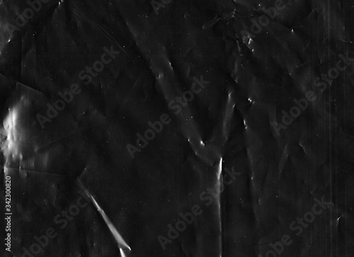 Aged abstract background. Black Friday. Scratches on dark wrinkled old film texture.