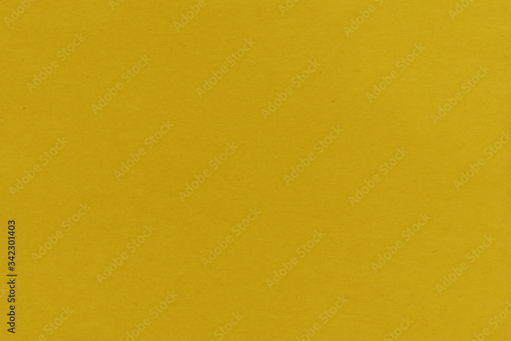 Close-up texture of yellow crepe corrugated blotting paper for DIY. Concept of choice. Soft focus, high contrast, horizontal background shot Close-up texture of yellow crepe corrugated blotting paper for DIY. Concept of choice. Soft focus, high contrast, horizontal background shot