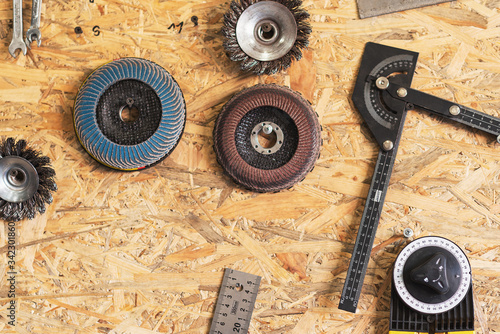 Various construction tools are hanging on the osb board