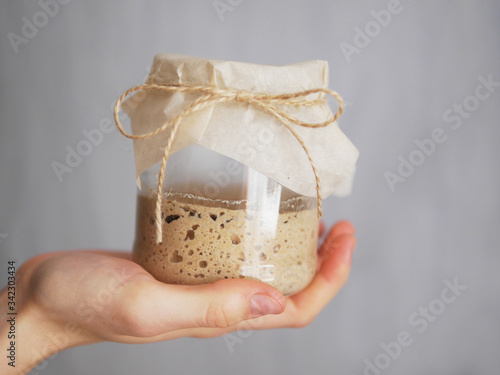 Homemade bread sourdough in a glass jar.