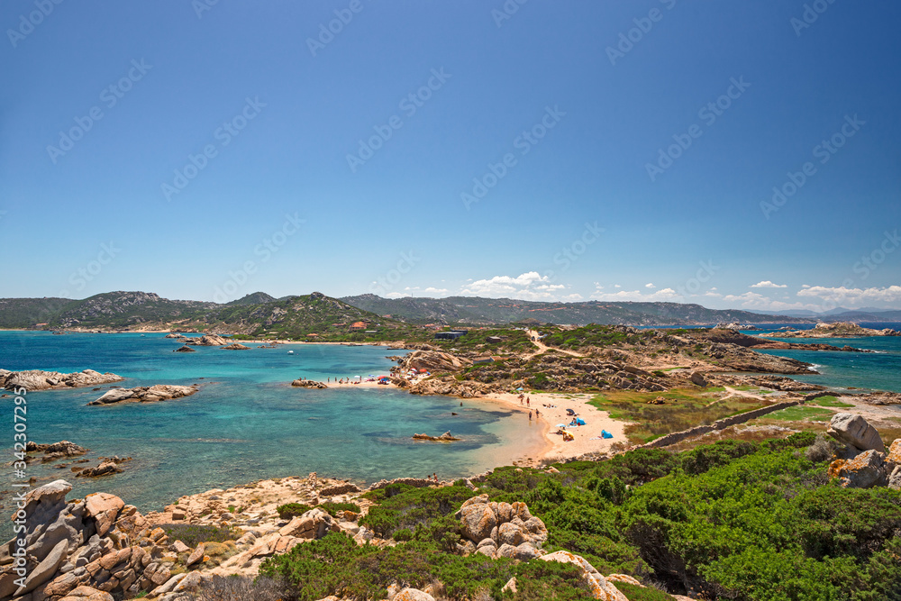 Panoramic view of the sunny beaches, and of the clear and transparent waters of the island of Maddalena in Sardinia, Italy.
