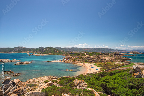 Panoramic view of the sunny beaches, and of the clear and transparent waters of the island of Maddalena in Sardinia, Italy.