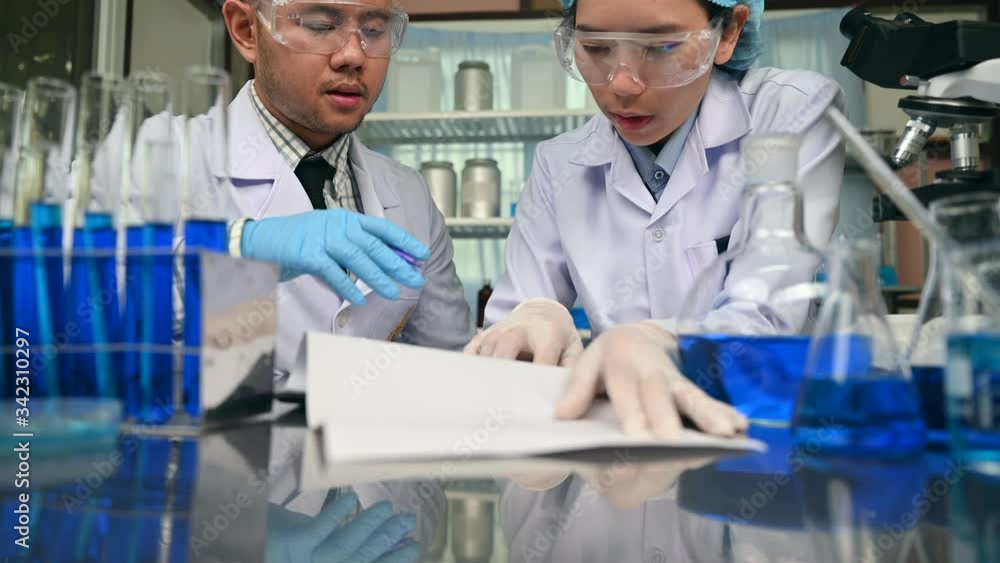 Scientists are discussing the analytical results from laboratory data. Scientists are discussing the analytical results from laboratory data.