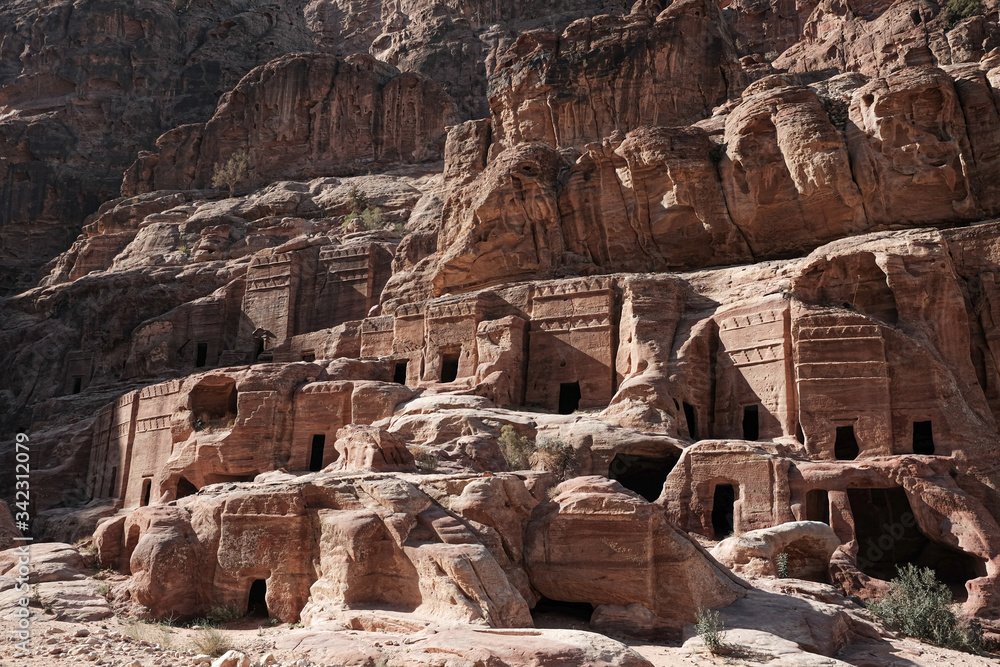 Close to high tomb facades at street of facades in Petra , Jordan